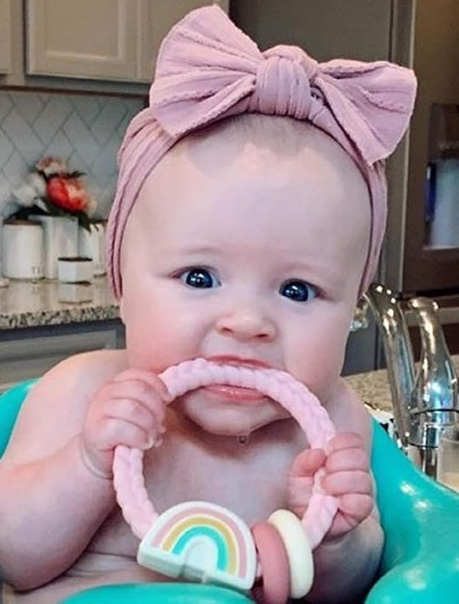 Itzy Ritzy Silicone Teether with Rattle; Rattle Teether Features Rattling Sound, Two Silicone Teething Rings and Raised Texture to Soothe Gums; Ages 3 Months and Up (Pink Rainbow)