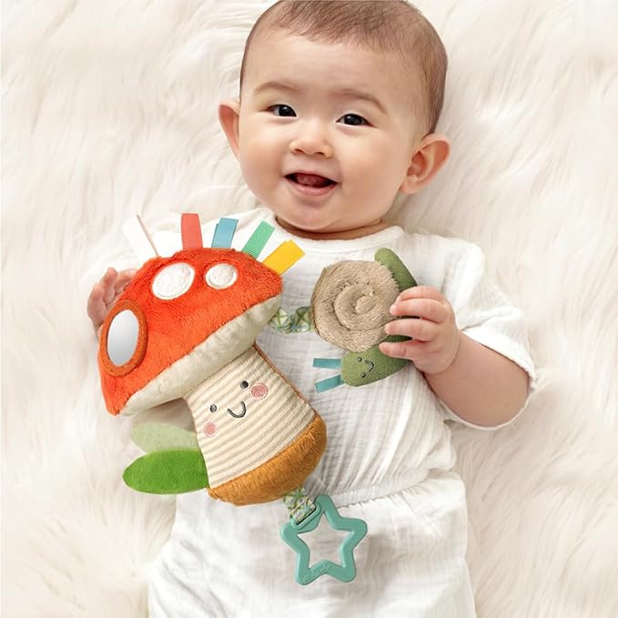 Itzy Ritzy Bitzy Traveler Car Seat & Stroller Toy for Babies – Developmental Sensory Toy Features Crinkle & Rattle Sounds & Multiple Textures –Hanging Travel Toy for On-the-Go Entertainment (Mushroom)