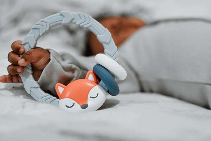 Itzy Ritzy Silicone Teether with Rattle; Rattle Teether Features Rattling Sound, Two Silicone Teething Rings and Raised Texture to Soothe Gums; Ages 3 Months and Up (Fox)