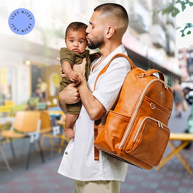 Itzy Ritzy Diaper Bag Backpack – Large Capacity Boss Plus Baby Backpack Diaper Bag Featuring 19 Pockets, Changing Pad, Stroller Clips, and Comfortable Straps (Cognac)