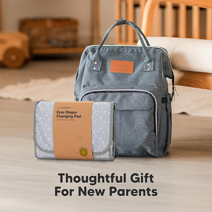 KeaBabies Portable Diaper Changing Pad - Large Waterproof Baby Changing Mat, Compact Travel Diaper Clutch, Functional Pockets Fit Newborn Essentials, Wipeable & Padded Baby Changer (Wild Patrol)