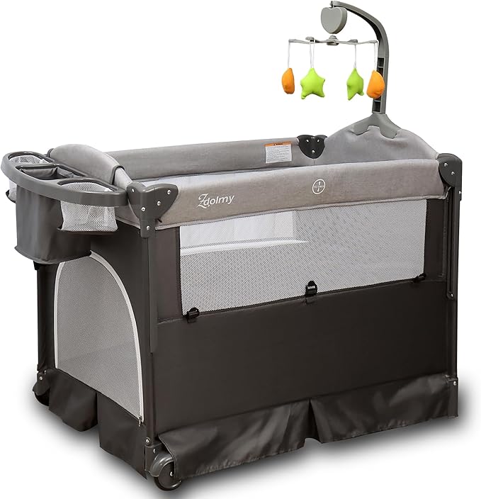 Zdolmy Baby Bedside Sleeper Bassinet, 4-in-1 Pack and Play with Bassinet w/Diaper Changing Table & Storage Bag, 3 Adjustable Heights, Toy Arch & Music, Portable Baby Play Yard with Carry Bag