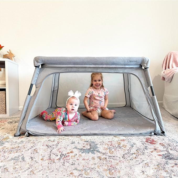 Newton Baby Deluxe Travel Crib & Play Yard | Largest in Class, Breathable, Washable Mattress, Foldable Playpen for Toddlers, Travel Bag, Grey